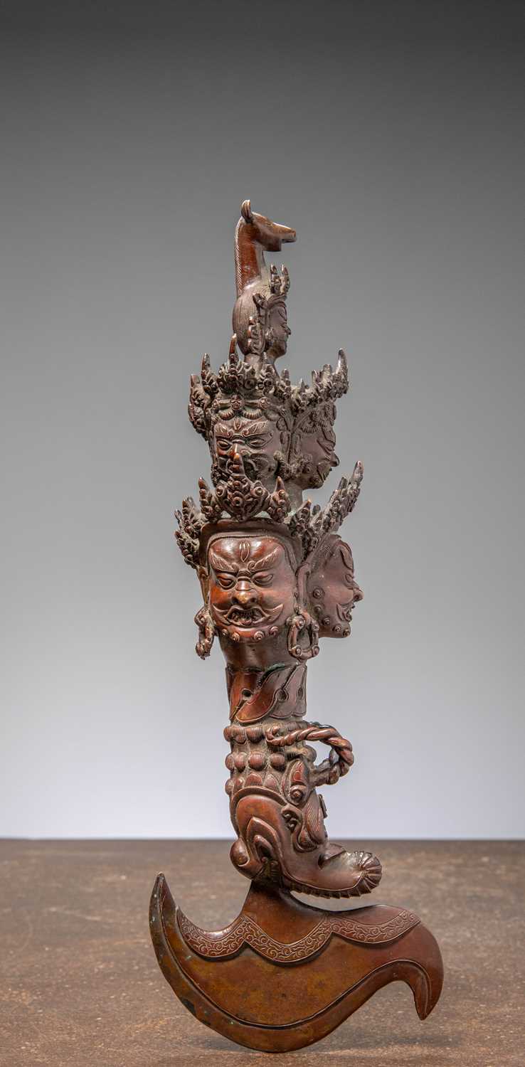Lot 16 - (R) A BRONZE RITUAL PHURBA (KĪLA) TIBET 19TH CENTURY