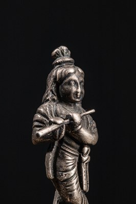 Lot 53 - (R) A SILVER FIGURE OF STANDING KRISHNA PLAYING THE FLUTE INDIA 19TH CENTURY