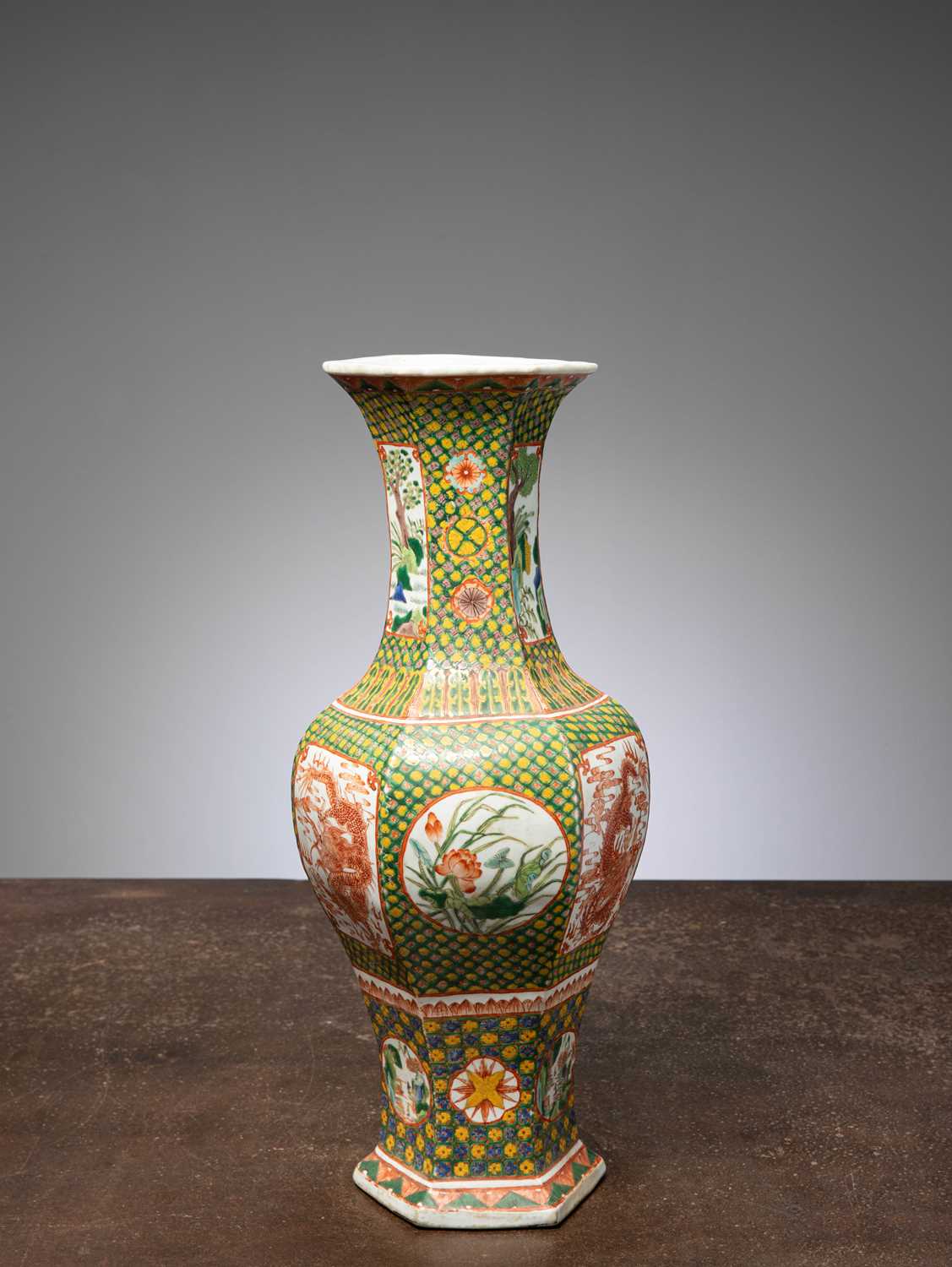 Lot 67 - (R) A LARGE FAMILLE VERTE HEXAGONAL VASE WITH DRAGON AND FLORAL PANELS
