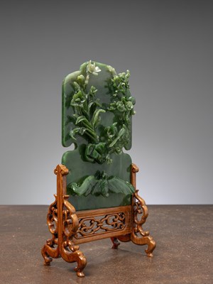 Lot 50 - (R) A GREEN JADE SCREEN WITH BAT, FLOWERS, AND BIRDS QING DYNASTY (1644-1911) China