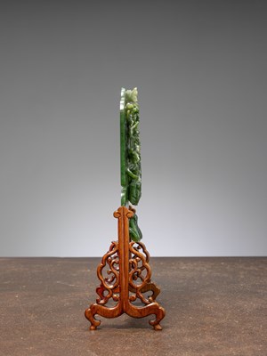 Lot 50 - (R) A GREEN JADE SCREEN WITH BAT, FLOWERS, AND BIRDS QING DYNASTY (1644-1911) China