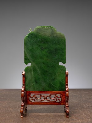 Lot 50 - (R) A GREEN JADE SCREEN WITH BAT, FLOWERS, AND BIRDS QING DYNASTY (1644-1911) China