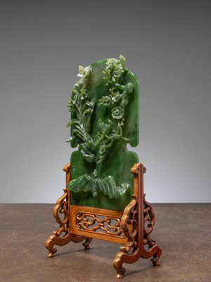 Lot 50 - (R) A GREEN JADE SCREEN WITH BAT, FLOWERS, AND BIRDS QING DYNASTY (1644-1911) China