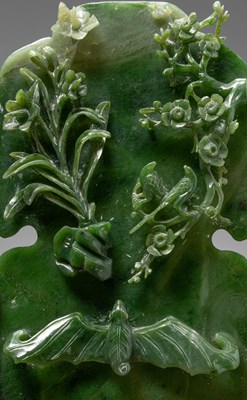 Lot 50 - (R) A GREEN JADE SCREEN WITH BAT, FLOWERS, AND BIRDS QING DYNASTY (1644-1911) China