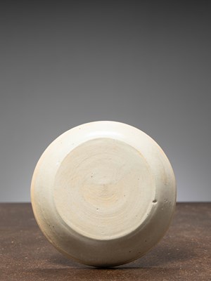 Lot 35 - (R) A CARVED AND MOULDED CELADON-GLAZED DISH, CHINA SONG DYNASTY 12TH CENTURY