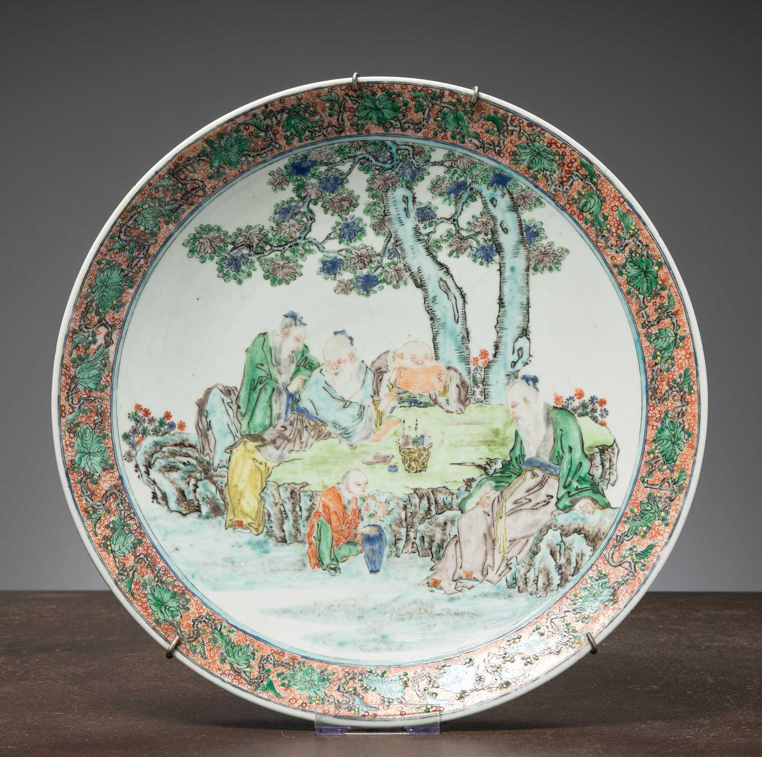 Lot 58 - (R) A LARGE FAMILLE VERTE PORCELAIN DISH WITH SCHOLARS IN A GARDEN QING DYNASTY CHINA 1820 - 1850