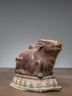 Lot 279 - A COPPER REPOUSSE NANDI FROM NEPAL, 18TH CENTURY, WITH INSCRIPTION