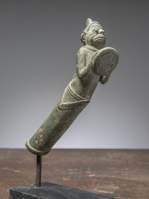 Lot 396 - A HANUMAN HOLDING A DISC KNIFE HANDLE, BRONZE, CAMBODIA, 12TH CENTURY