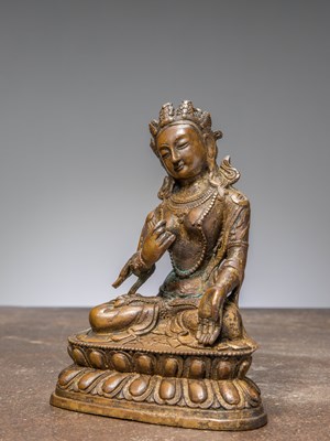 Lot 42 - A SEATED BRONZE TARA WITH REMAINS OF GILDING, CHINA QING DYNASTY
