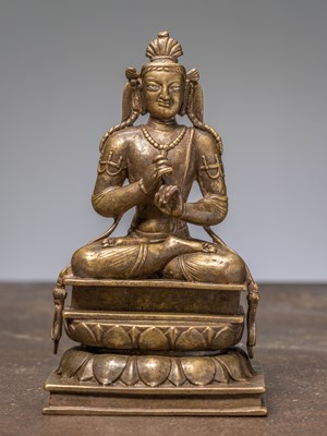 Lot 226 - A SEATED BODHISATTVA, BRONZE WITH SILVER EYES, KASHMIR, 12TH CENTURY