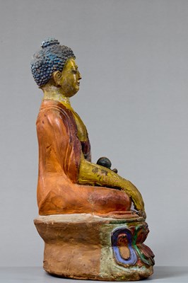 Lot 4 - A LARGE TIBETAN CLAY TSA TSA WITH POLYCHROME PIGMENTS DEPICTING BUDDHA AKSHOBYA, 18TH CENTURY