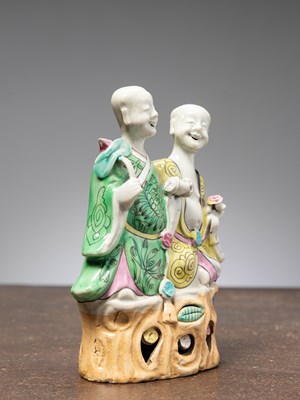 Lot 36 - (R) A PORCELAIN STATUE OF LAUGHING TWINS, LATE CHIEN LUNG PERIOD, CHINA, 1780/1790