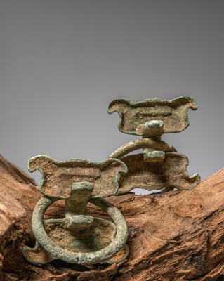 Lot 84 - (R) A PAIR OF BRONZE FITTINGS WITH TAOTIE MASKS, CHINA, WARRING STATES PERIOD, 4TH TO 3RD CENTURY BC