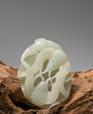 Lot 146 - (R) A LIGHT GREEN JADE CARVING OF A CRAB AND TWO OCTOPUSES, CHINA, 19TH CENTURY, WHITE JADE