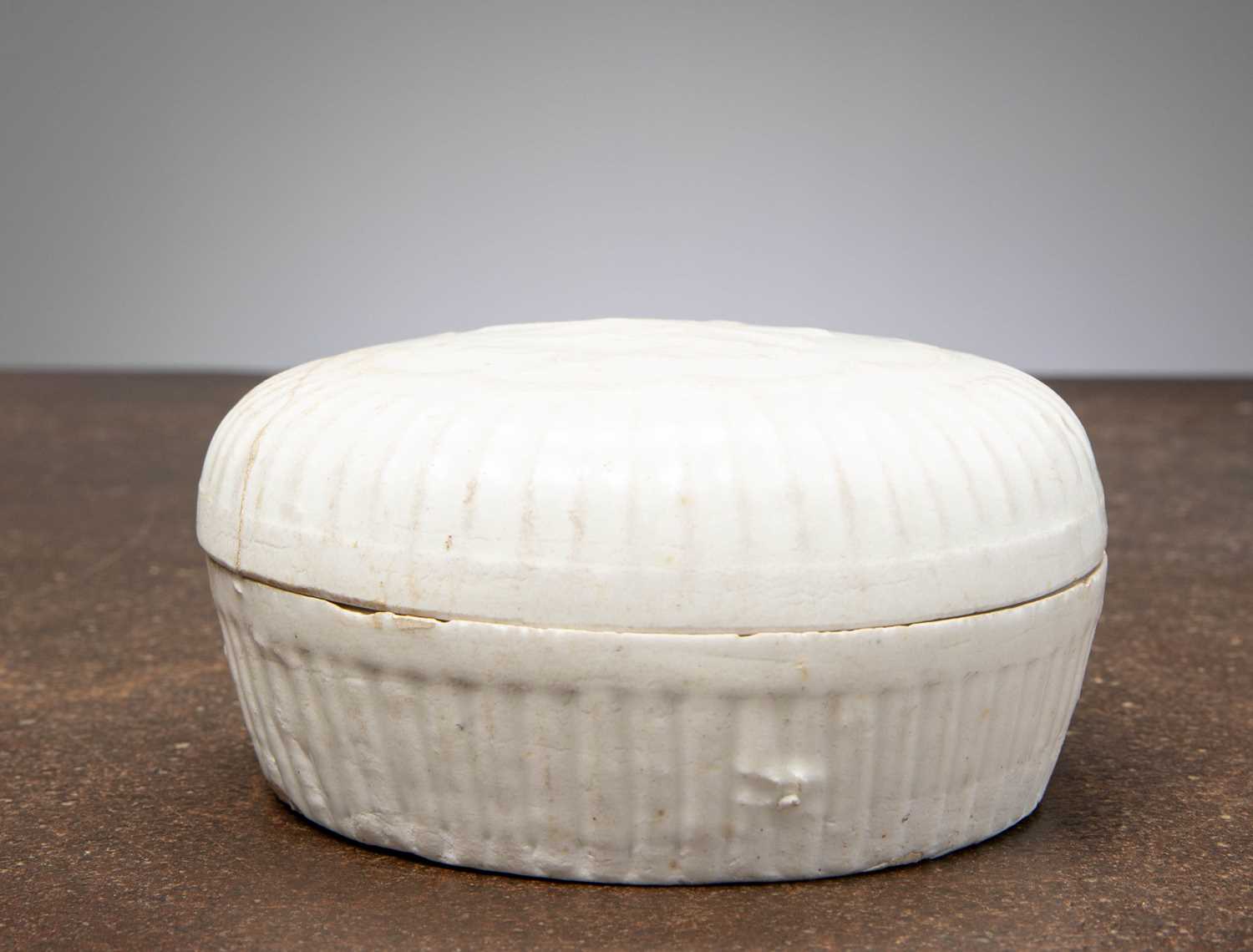 Lot 19 - (R) A WHITE-GLAZED PORCELAIN LIDDED JAR, CHINA, YUAN DYNASTY, 14TH CENTURY