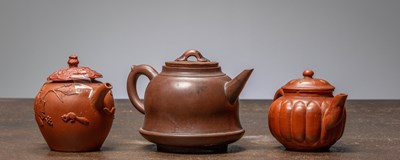 Lot 427 - (R) THREE CHINESE YIXING TEAPOTS, LATE QING DYNASTY