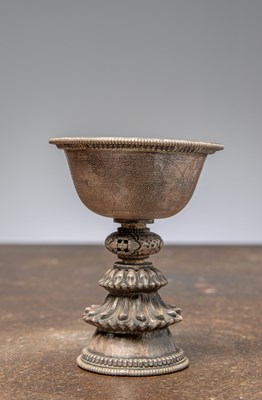 Lot 88 - (R) A SILVER EMBOSSED OFFERING LAMP, TIBET, 19TH CENTURY