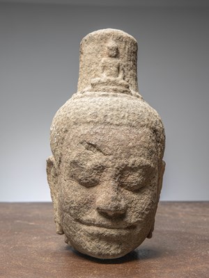 Lot 14 - (R) AN EXQUISITE KHMER SANDSTONE BUDDHIST HEAD, CAMBODIA, 12TH CENTURY