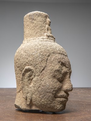 Lot 14 - (R) AN EXQUISITE KHMER SANDSTONE BUDDHIST HEAD, CAMBODIA, 12TH CENTURY