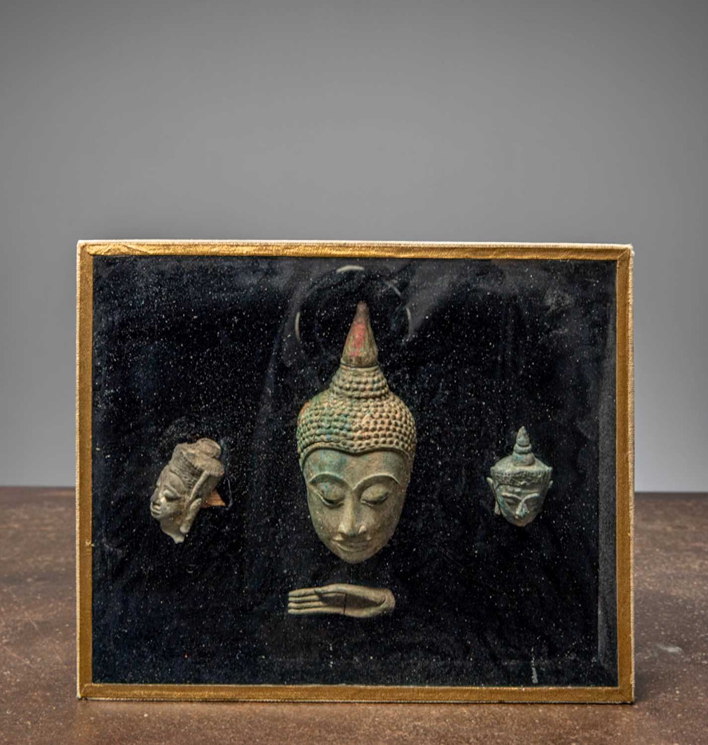 Lot 37 - (R) A COMPOSITION OF BRONZE BUDDHA HEADS AND HAND, THAILAND, AYUTTHAYA PERIOD