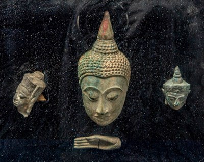 Lot 37 - (R) A COMPOSITION OF BRONZE BUDDHA HEADS AND HAND, THAILAND, AYUTTHAYA PERIOD