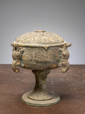Lot 83 - (R) A CHINESE BRONZE COVERED DOU RITUAL VESSEL ON STEM, EASTERN ZHOU STYLE, 19TH CENTURY