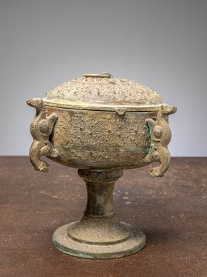 Lot 83 - (R) A CHINESE BRONZE COVERED DOU RITUAL VESSEL ON STEM, EASTERN ZHOU STYLE, 19TH CENTURY
