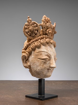 Lot 3 - A HEAD OF A BODHISATTVA, TERRACOTTA WITH POLYCHROME, PAKISTAN, HUND REGION, 5TH–7TH CENTURY
