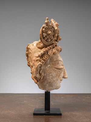 Lot 3 - A HEAD OF A BODHISATTVA, TERRACOTTA WITH POLYCHROME, PAKISTAN, HUND REGION, 5TH–7TH CENTURY
