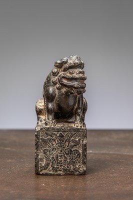 Lot 107 - A BLACK STONE CARVED GUARDIAN (SHISHI), CHINA, 16TH CENTURY