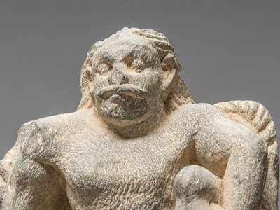 Lot 2 - A GREY SCHIST GANDHARA STATUE DEPICTING AN ATLAS AFGHANISTAN $TH CENTURY