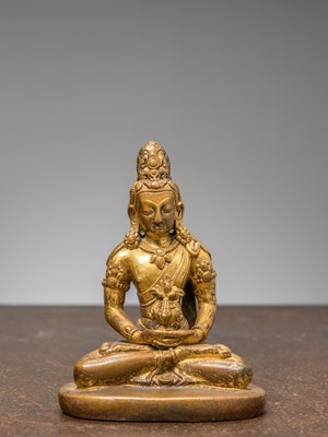 Lot 281 - A SEATED BRONZE GILT BUDDHA AMITAYUS, TIBET, 15TH CENTURY