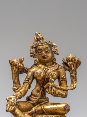 Lot 35 - A GILT-BRONZE FIGURE OF GREEN TARA, TIBET, 18TH CENTURY