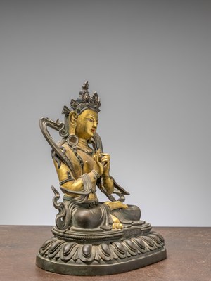 Lot 96 - A SEATED BRONZE COLD GILT BODHISATTVA, CHINA 18TH CENTURY, QIAN LONG PERIOD