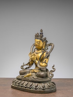Lot 96 - A SEATED BRONZE COLD GILT BODHISATTVA, CHINA 18TH CENTURY, QIAN LONG PERIOD