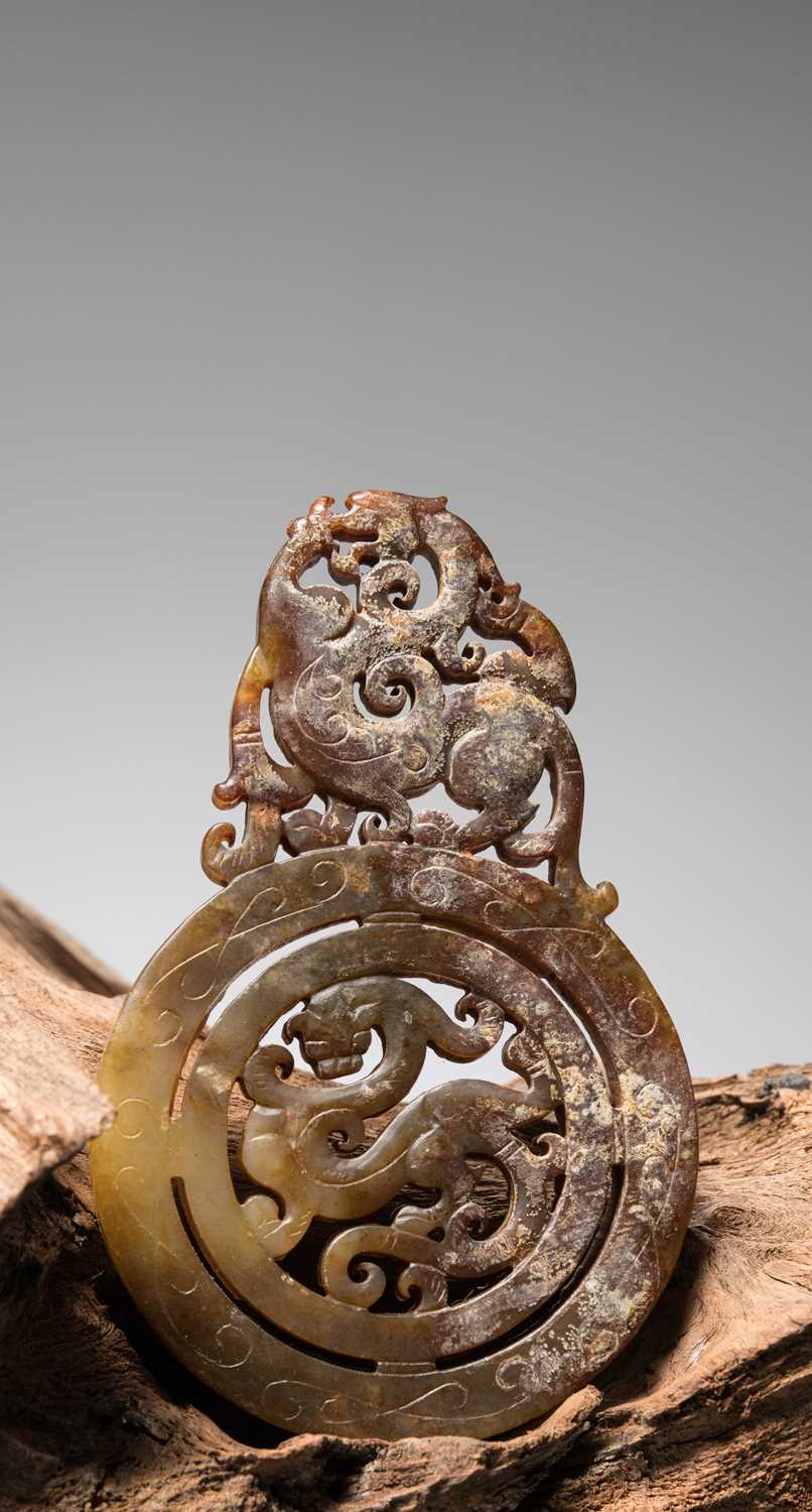Lot 50 - A HAN DYNASTY OPENWORK JADE BI DISC, CHINA