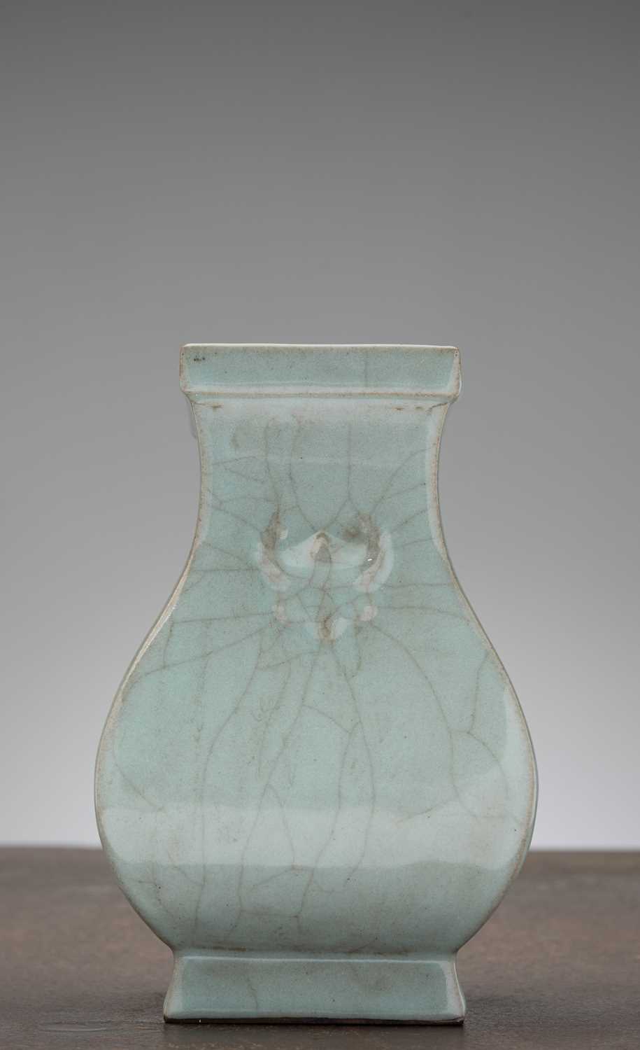 Lot 92 - A CHINESE PALE CELADON-GLAZED SQUARE-SECTION VASE, QING DYNASTY