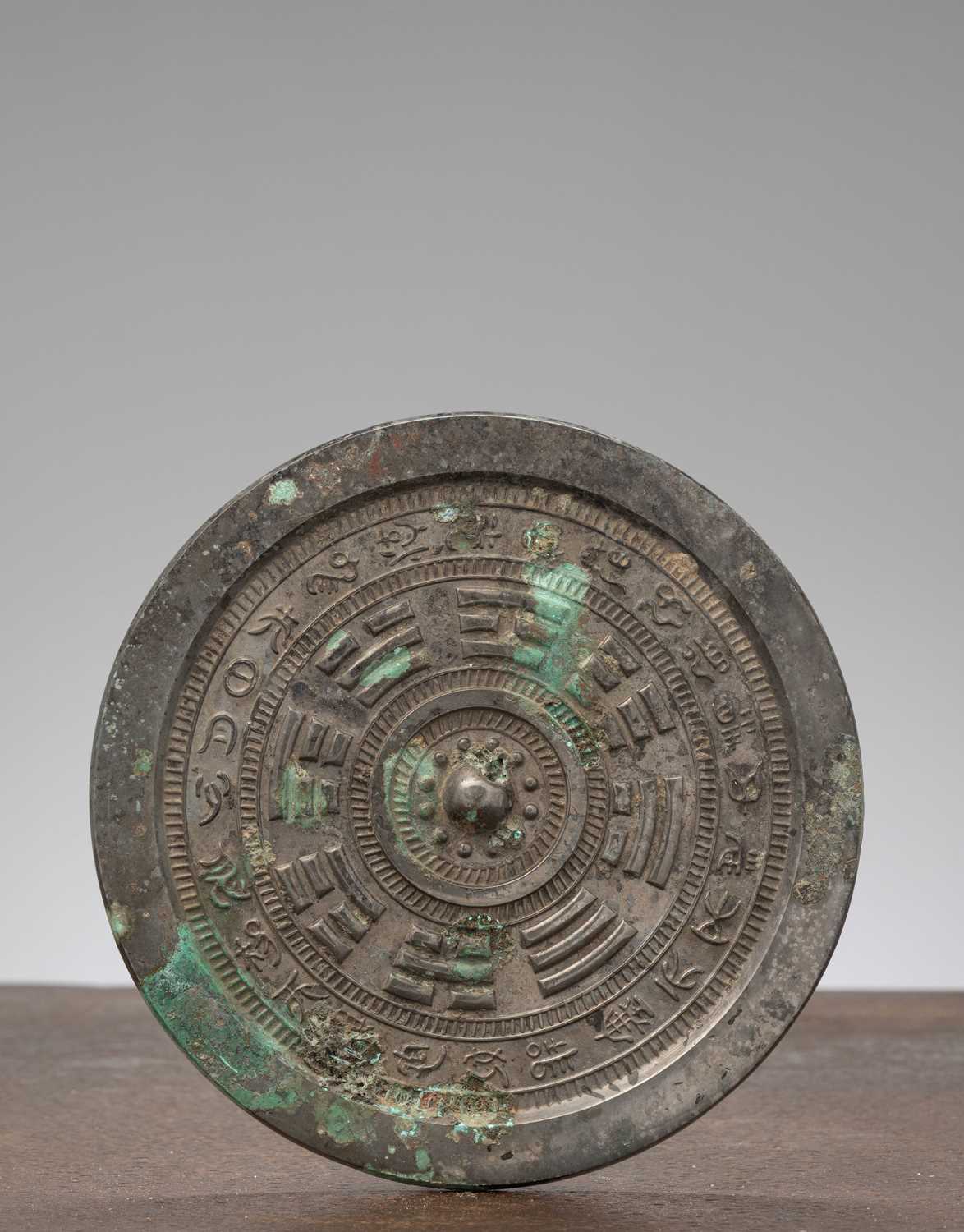 Lot 65 - A CHINESE BRONZE MIRROR WITH BAGUA DESIGN, CHINA, PROBABLY HAN DYNASTY OR LATER