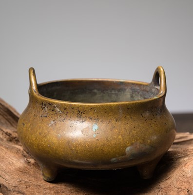 Lot 59 - A BRONZE TRIPOD CENSER WITH LOOP HANDLES CHINA, CAST WITH A XUANDE MARK