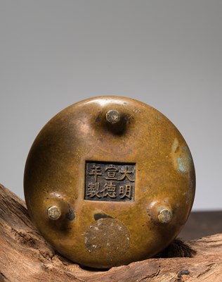 Lot 59 - A BRONZE TRIPOD CENSER WITH LOOP HANDLES CHINA, CAST WITH A XUANDE MARK