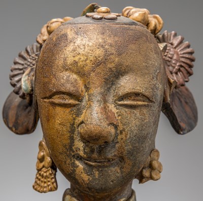 Lot 33 - A GLAZED FEMALE DEITY HEAD, SOUTH-CHINA 18TH CENTURY