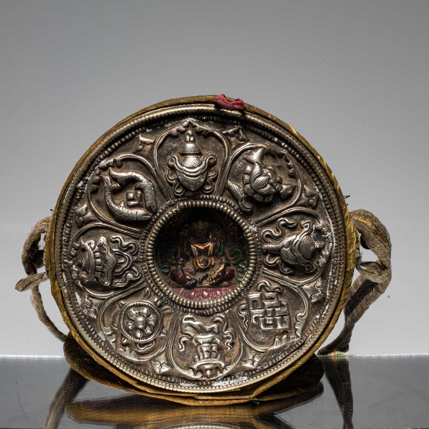 Lot 6 - SILVER AND COPPER GAU WITH CLAY JAMBHALA INSIDE TIBET 18TH CENTURY