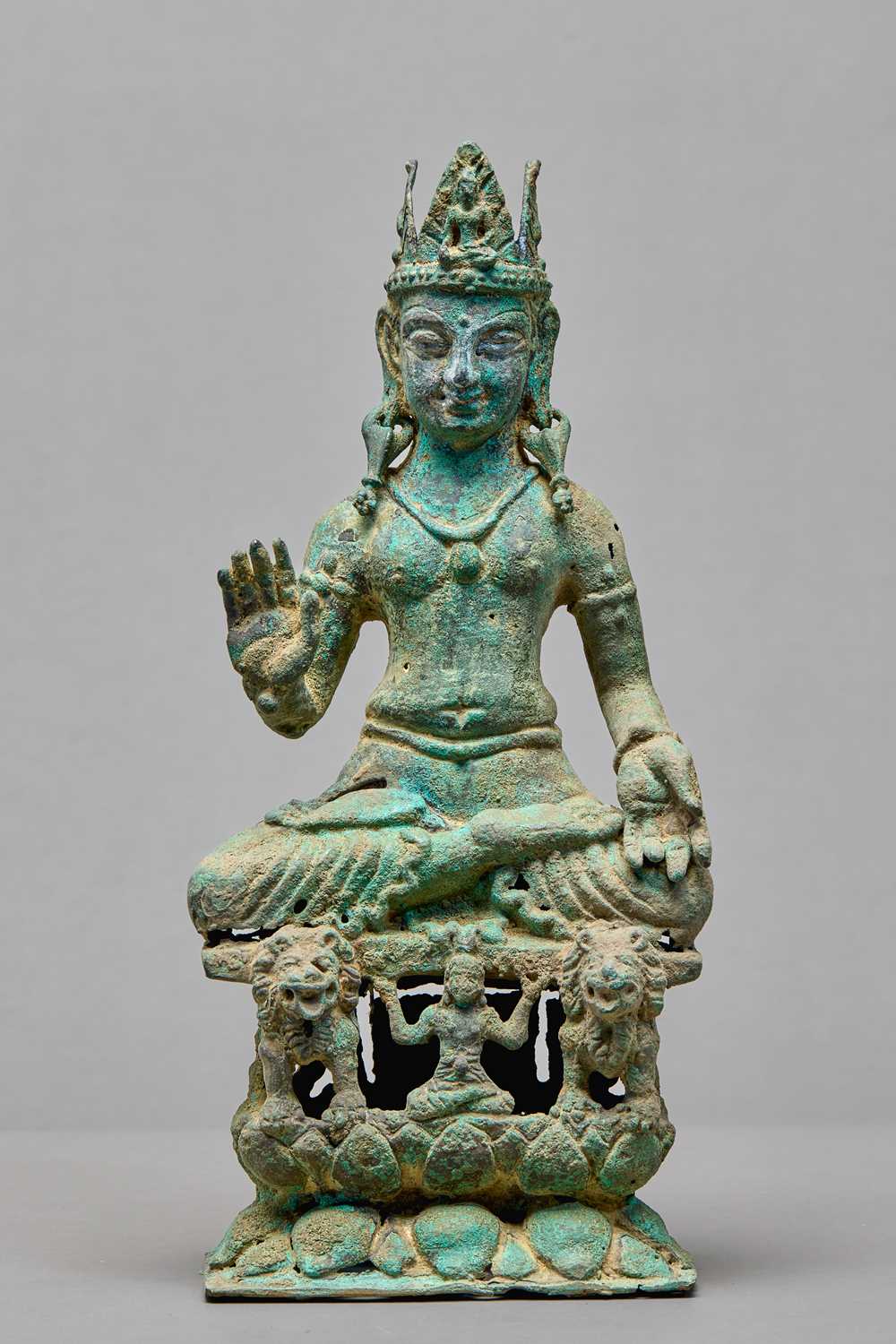 Lot 91 - SEATED BRONZE BODHISATTVA ON A LION THRONE, KASHMIR, 12TH CENTURY