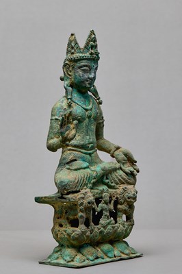 Lot 91 - SEATED BRONZE BODHISATTVA ON A LION THRONE, KASHMIR, 12TH CENTURY