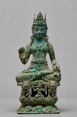 Lot 91 - SEATED BRONZE BODHISATTVA ON A LION THRONE, KASHMIR, 12TH CENTURY
