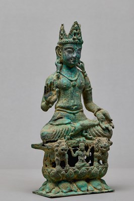 Lot 91 - SEATED BRONZE BODHISATTVA ON A LION THRONE, KASHMIR, 12TH CENTURY
