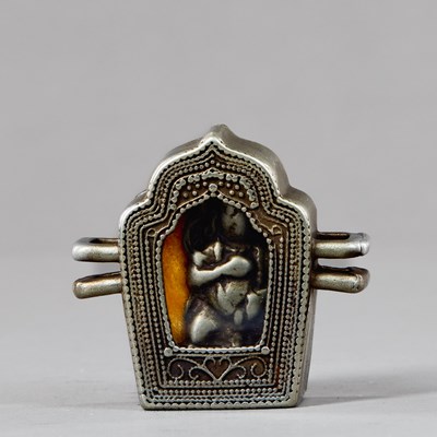 Lot 438 - SILVER AND COPPER GAU WITH JAMBHALA INSIDE, TIBET 18TH CENTUY
