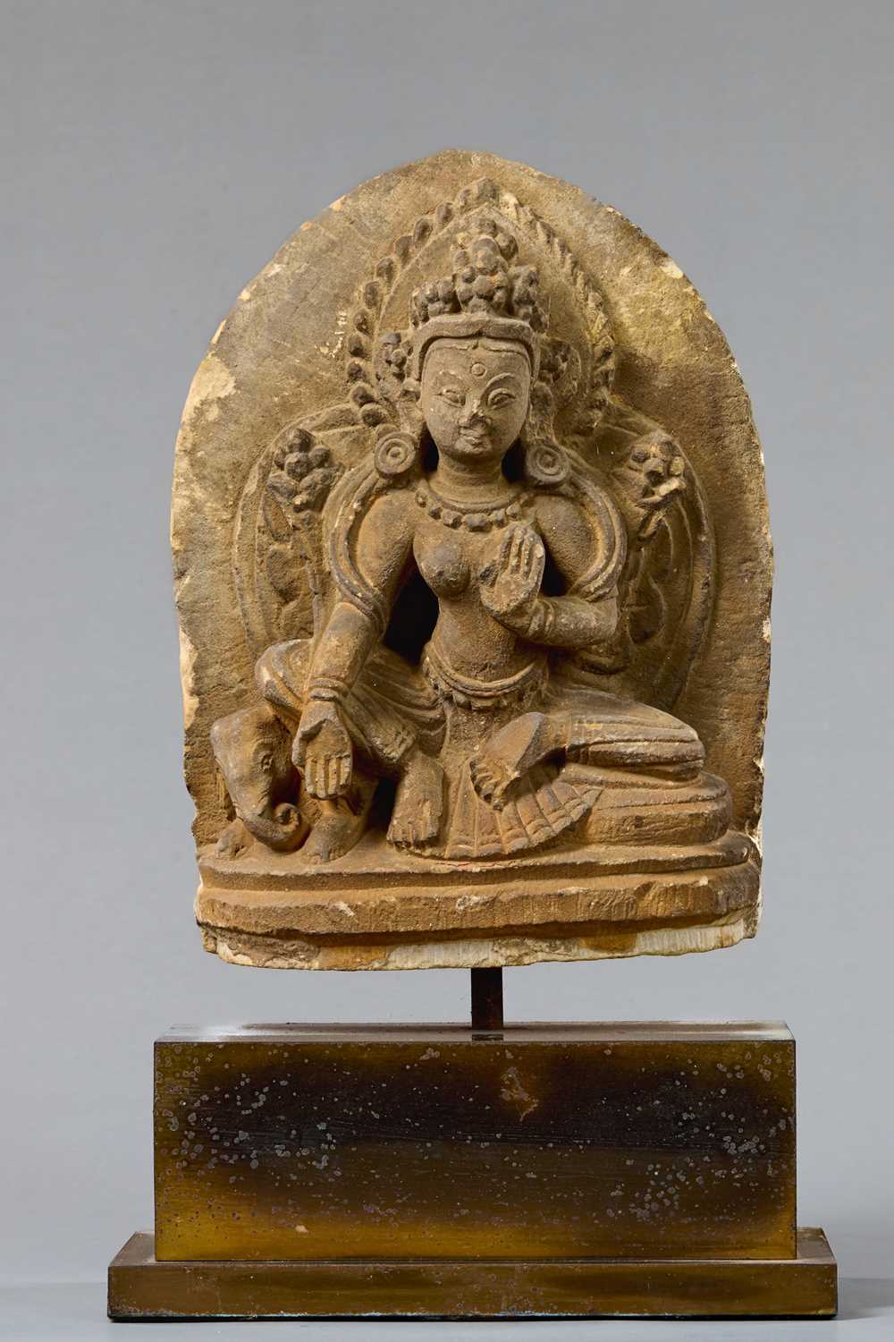 Lot 57 - SEATED GREEN TARA STONE NEPAL 18TH CENTURY