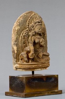 Lot 57 - SEATED GREEN TARA STONE NEPAL 18TH CENTURY