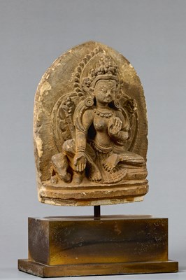 Lot 57 - SEATED GREEN TARA STONE NEPAL 18TH CENTURY